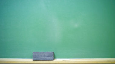 A blank green horizontal chalkboard with chalk and eraser. 14MP camera.